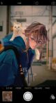  1boy bad_link blonde_hair blue_eyes blurry blurry_background cat cellphone_photo earrings highres hood hood_down jewelry link male_focus pointy_ears sidelocks solo the_legend_of_zelda the_legend_of_zelda:_breath_of_the_wild the_legend_of_zelda:_tears_of_the_kingdom 