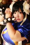  1girl asian black_hair breasts capcom chun-li chun-li_(cosplay) cosplay fat large_breasts looking_at_viewer luu_(cosplayer) photo street_fighter 