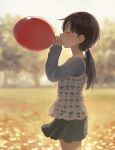 ball balloon bangs black_hair black_skirt blowing blurry blurry_background blush brown_hair child closed_eyes commentary cowboy_shot from_side gin_(minamito3) hands_up highres holding holding_ball holding_balloon layered_clothing long_hair long_sleeves miniskirt muted_color open_mouth original outdoors ponytail red_balloon skirt sleeves_past_wrists solo standing swept_bangs tree 