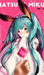  39 animal_ears blue_eyes blue_hair blurry blurry_foreground blush bunny_ears commentary_request condom condom_wrapper covering_mouth depth_of_field embarrassed hairband hatsune_miku holding holding_condom long_hair openvl pink_background tattoo twintails vocaloid 