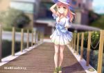  absurdres arm_at_side b.ren blonde_hair blurry blurry_background chain character_name dated dress flower green_footwear grin hair_down hand_on_headwear hat hat_flower highres jewelry long_hair looking_at_viewer love_live! love_live!_sunshine!! ohara_mari open_toe_shoes outdoors pendant pier sash short_sleeves smile solo standing sun_hat white_dress yellow_eyes 