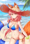  absurdres animal_ear_fluff animal_ears april_cho bikini blue_bikini breasts cleavage day ears_through_headwear fate/extella fate/extra fate/grand_order fate_(series) fox_ears fox_tail groin hat highres innertube large_breasts long_hair looking_at_viewer navel ocean outdoors palm_tree pink_hair side-tie_bikini smile solo straw_hat swimsuit tail tamamo_(fate)_(all) tamamo_no_mae_(swimsuit_lancer)_(fate) tree yellow_eyes 