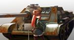  breasts commentary envada ground_vehicle hammer_and_sickle hat jacket long_hair military military_vehicle motor_vehicle original red_eyes red_hair shorts su-85 tank tank_destroyer weapon 