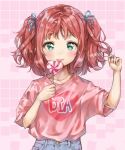  bangs blue_ribbon candy casual clothes_writing commentary_request denim eyebrows_visible_through_hair food green_eyes hair_ribbon heart heart_lollipop heart_print highres holding_lollipop jeans kurosawa_ruby lollipop looking_at_viewer love_live! love_live!_sunshine!! pants pink_background pink_shirt playing_with_own_hair print_shirt red_hair ribbon shirt smile solo takenoko_no_you two_side_up upper_body 