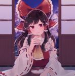  1girl ascot bare_shoulders black_hair blush bow chopsticks closed_mouth cup detached_sleeves fingernails hair_bow hair_tubes hakurei_reimu holding holding_cup indoors japanese_clothes long_hair looking_at_viewer mozukuzu_(manukedori) nontraditional_miko red_bow red_eyes ribbon-trimmed_sleeves ribbon_trim shouji sidelocks sliding_doors smile solo touhou twitter_username upper_body white_sleeves wide_sleeves yellow_ascot 