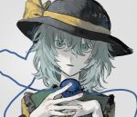  1girl black_hat black_mouth bow commentary_request crossed_bangs fingernails flipped_sidelocks frilled_sailor_collar frills green_eyes green_hair green_sailor_collar grey_background hair_between_eyes hands_up hat hat_bow heart heart_of_string highres holding komeiji_koishi looking_at_viewer miurayukihito open_mouth pale_skin portrait sailor_collar shirt simple_background solo touhou translation_request yarn yarn_ball yellow_bow yellow_shirt 