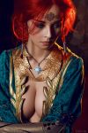  1girl blue_eyes breasts circlet cleavage cosplay costume dress freckles helly_von_valentine_(disharmonica) indoors jewelry large_breasts long_hair necklace no_bra pendant photo red_hair robe side_braids solo the_witcher triss_merigold 