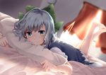  bangs barefoot bed_sheet bedroom blue_dress blue_eyes blue_hair blush bow cirno closed_mouth commentary curtains day dress dutch_angle green_bow hair_bow ice ice_wings indoors kuromame_(8gou) legs_up looking_at_viewer lying on_bed on_stomach pillow short_hair short_sleeves smile solo sunlight the_pose touhou transparent_wings window wings 