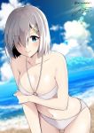  beach bikini blue_eyes blue_sky blurry breasts cleavage cloud collarbone commentary_request cowboy_shot dated day depth_of_field eyebrows_visible_through_hair hair_ornament hair_over_one_eye hairclip hamakaze_(kantai_collection) kantai_collection large_breasts leaning_forward lens_flare light_rays lips looking_at_viewer mimamui navel outdoors short_hair signature silver_hair sky solo sunbeam sunlight swimsuit twitter_username white_bikini 