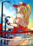  ass back baseball_cap black_gloves blonde_hair blue_eyes blurry blurry_background bracelet breasts clothes_writing commentary commentary_typo cowboy_shot denim denim_shorts english english_commentary fatal_fury fine_fabric_emphasis fingerless_gloves ganassa genderswap genderswap_(mtf) gloves hat high-waist_shorts highres jewelry lips long_hair looking_back medium_breasts micro_shorts nose off_shoulder one_side_up shorts snk_heroines:_tag_team_frenzy solo strap_gap terry_bogard toned toon 