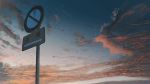 banishment check_translation cloud cloudy_sky directional_arrow highres no_entry_sign no_humans original outdoors road_sign scenery sign sky sunset translation_request 