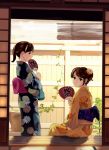  black_eyes black_kimono brown_hair commentary_request fan fence fingernails floral_print flower from_behind hair_flower hair_ornament holding ivy japanese_clothes kimono looking_at_viewer looking_back multiple_girls munakata_(hisahige) orange_flower orange_kimono original paper_fan parted_lips plant ponytail porch potted_plant short_hair sitting uchiwa wooden_fence yukata 