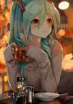  blurry cup depth_of_field eyebrows_visible_through_hair green_eyes green_hair hair_between_eyes hatsune_miku highres long_hair mug sleeves_past_wrists solo table takepon1123 twintails vocaloid 