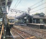  artist_name colored_pencil_(medium) commentary ground_vehicle hayashi_ryouta no_humans original outdoors power_lines railing railroad_tracks real_world_location scenery sign sky stairs telephone_pole traditional_media train train_station train_station_platform tree 
