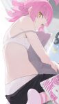  1girl ahoge black_shorts bra closed_mouth commentary_request headphones highres hiroki_(yyqw7151) looking_back love_live! love_live!_nijigasaki_high_school_idol_club off_shoulder panties pillow pink_hair short_hair shorts sitting stuffed_animal stuffed_toy tennouji_rina underwear white_bra white_panties yellow_eyes 