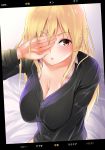  1girl amasora_taichi arm_up bangs bed_sheet black_shirt blonde_hair blush breasts brown_eyes cleavage collarbone commentary_request covering_one_eye dress_shirt eyebrows_visible_through_hair hair_between_eyes highres large_breasts long_hair looking_at_viewer open_clothes open_shirt original parted_lips phone_screen pink_shirt shirt solo very_long_hair 