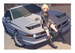  1girl aiguillette armband baronilu belt between_legs black_boots black_gloves black_jacket black_necktie black_skirt blonde_hair bmw boots border breasts brown_eyes building commission commissioner_upload garrison_cap girls'_frontline gloves hand_between_legs hat highres jacket knee_boots kneehighs looking_at_viewer medium_breasts medium_hair mp40_(girls'_frontline) necktie open_mouth outdoors pouch red_armband red_socks shirt sitting skeb_commission skirt socks solo thigh_strap unworn_headwear white_border white_shirt window 