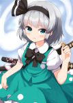  1girl black_bow black_bowtie black_hairband blush bow bowtie closed_mouth collared_shirt commentary_request green_eyes green_skirt green_vest grey_hair hairband highres hitodama hitodama_print katana konpaku_youmu konpaku_youmu_(ghost) looking_at_viewer multiple_swords puffy_short_sleeves puffy_sleeves ruu_(tksymkw) sheath sheathed shirt short_sleeves skirt skirt_set solo sword touhou vest weapon white_shirt 