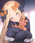  1girl abigail_williams_(fate/grand_order) bangs black_bow black_dress black_hat blonde_hair blue_eyes blush bow closed_mouth commentary_request dress eyebrows_visible_through_hair fate/grand_order fate_(series) forehead hair_bow hat head_tilt io_(io_oekaki) long_hair long_sleeves looking_at_viewer object_hug orange_bow parted_bangs polka_dot polka_dot_bow sleeves_past_fingers sleeves_past_wrists smile solo stuffed_animal stuffed_toy teddy_bear upper_body very_long_hair 