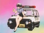  1girl 90s animated animated_gif arm_support bakuretsu_hunters black_hair black_shoes blue_background breasts brown_eyes car daughter_(bakuretsu_hunters) female gradient gradient_background grin ground_vehicle hat large_breasts legs looking_at_viewer motor_vehicle multicolored multicolored_background pink_background pointy_ears police police_car police_hat police_uniform policewoman shoes short_hair sitting smile solo subtitled talking uniform white_background 