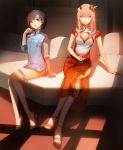  2girls blackrabbitsoul blue_footwear blue_hair bob_cut brown_footwear china_dress chinese_clothes cleavage_cutout cocktail_glass couch cup darling_in_the_franxx dress drink drinking_glass food fruit green_eyes high_heels highres holding holding_food ichigo_(darling_in_the_franxx) long_hair multiple_girls pink_hair short_dress short_hair side_slit sitting smile strawberry zero_two_(darling_in_the_franxx) 