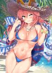  1girl ;3 animal_ear_fluff animal_ears bare_arms bare_shoulders beach bikini blue_bikini blue_sky blush bracelet breasts closed_mouth cloud commentary_request cowboy_shot day dutch_angle ears_through_headwear eyebrows_visible_through_hair fate/extra fate/grand_order fate_(series) fox_ears fox_girl fox_tail gluteal_fold hair_between_eyes hat highres hip_focus holding innertube jewelry kawai large_breasts leaf long_hair looking_at_viewer navel necklace ocean one_eye_closed outdoors palm_tree pink_hair sash shiny shiny_skin sidelocks sky smile solo standing straw_hat string_bikini sun_hat sunlight swimsuit tail tamamo_(fate)_(all) tamamo_no_mae_(fate) tamamo_no_mae_(swimsuit_lancer)_(fate) thigh_gap thighs tree umbrella water yellow_eyes 