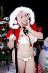  1girl asian breasts chouzuki_maryou christmas christmas_tree cosplay headphones highres large_breasts nitroplus photo pink_hair plump solo super_sonico super_sonico_(cosplay) 