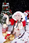  1girl asian breasts chouzuki_maryou christmas christmas_tree cosplay headphones highres large_breasts nitroplus photo pink_hair plump solo super_sonico super_sonico_(cosplay) 