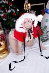  1girl asian breasts chouzuki_maryou christmas christmas_tree cosplay headphones highres large_breasts nitroplus photo pink_hair plump solo super_sonico super_sonico_(cosplay) 