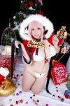  1girl asian breasts chouzuki_maryou christmas christmas_tree cosplay headphones highres large_breasts nitroplus photo pink_hair plump solo super_sonico super_sonico_(cosplay) 