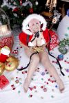  1girl asian breasts chouzuki_maryou christmas christmas_tree cosplay headphones highres large_breasts nitroplus photo pink_hair plump solo super_sonico super_sonico_(cosplay) 