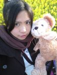  1girl asian black_hair brown_eyes chouzuki_maryou flower looking_at_viewer mole ponytail scarf solo stuffed_animal stuffed_toy teddy_bear 