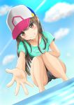  1girl absurdres barefoot baseball_cap blue_shirt brown_eyes brown_hair cameltoe cloud grin hat highres long_hair ninyo_(user_pddg5877) one-piece_swimsuit original outstretched_arm outstretched_hand school_swimsuit shirt sky smile solo squatting swimsuit wading water 