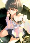  1girl blurry bob_cut bra brown_hair condom_wrapper depth_of_field glasses green_eyes holding kamizuki_shiki lips mole mole_under_eye original rimless_eyewear school_uniform shirt_down short_hair solo sweatdrop underwear 