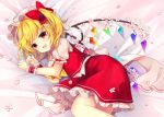  1girl :d ascot bangs bed_sheet blonde_hair blush bow cherry_blossoms commentary_request crystal eyebrows_visible_through_hair fang feet_out_of_frame flandre_scarlet hands_up hat hat_bow highres looking_at_viewer lying mob_cap on_side one_side_up open_mouth petals petticoat puffy_short_sleeves puffy_sleeves red_bow red_eyes red_skirt red_vest ruhika shirt short_hair short_sleeves skirt skirt_set smile solo touhou vest white_headwear white_shirt wings wrist_cuffs yellow_neckwear 