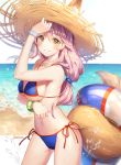  1girl animal_ear_fluff animal_ears artist_name bangle bare_arms bare_shoulders beach bikini blue_bikini bracelet breasts brown_eyes cowboy_shot ears_through_headwear fate/grand_order fate_(series) fox_ears fox_tail grin hand_up hat horizon innertube jewelry large_breasts long_hair looking_at_viewer low-tied_long_hair navel ocean pink_hair roang sand side-tie_bikini smile solo standing stomach straw_hat swimsuit tail tamamo_(fate)_(all) tamamo_no_mae_(fate) thighs water 