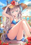  1girl armpits bangs bare_shoulders bikini blue_bikini blue_eyes blue_sky blush breasts cleavage crossed_legs day eyebrows_visible_through_hair fate/grand_order fate_(series) hair_between_eyes hand_on_headwear hat highres long_hair looking_at_viewer marie_antoinette_(fate/grand_order) medium_breasts open_mouth outdoors petals rin_yuu sidelocks silver_hair sitting sky smile solo sun_hat swimsuit thighs twintails very_long_hair 