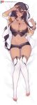  1girl arm_up ass_visible_through_thighs azur_lane bangle bracelet braid breasts brown_eyes brown_hair cleavage commentary crop_top dakimakura dark_skin english_commentary full_body hair_between_eyes hair_ornament highres jewelry large_breasts long_hair lying midriff nanoless navel necklace off_shoulder on_back one_eye_closed open_mouth patreon_username pendant short_shorts shorts side_braid solo south_dakota_(azur_lane) thighhighs toeless_legwear white_legwear 