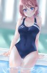  1girl ass_visible_through_thighs blue_eyes blue_swimsuit blurry blurry_background blush brown_hair commentary_request covered_navel highres looking_at_viewer love_live! love_live!_sunshine!! minori_748 one-piece_swimsuit school_swimsuit short_hair smile soaking_feet solo swimsuit thigh_gap watanabe_you wet 
