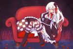  1girl azur_lane bangs black_flower black_footwear black_rose black_skirt boots bow breasts center_frills checkered commentary_request couch erebus_(azur_lane) flower frills hair_between_eyes hair_flower hair_ornament hand_up high-waist_skirt long_hair long_sleeves medium_breasts on_couch pillow red_bow red_eyes rose sakurato_ototo_shizuku shirt skirt sleeves_past_wrists solo striped striped_legwear thighhighs very_long_hair water white_hair white_shirt wide_sleeves 
