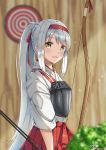  1girl arrow as4gi bangs blush bow_(weapon) day eyebrows_visible_through_hair hairband hakama hakama_skirt headband holding holding_arrow holding_bow_(weapon) holding_weapon japanese_clothes kantai_collection long_hair muneate open_mouth ponytail red_hairband red_skirt shoukaku_(kantai_collection) signature silver_hair skirt solo target tasuki weapon yellow_eyes 