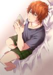  1boy absurdres bed bed_sheet blush bunmare cellphone highres holding holding_cellphone holding_phone idolmaster idolmaster_side-m implied_masturbation looking_down lying male_focus on_back on_bed open_mouth orange_hair phone pillow smartphone solo sweatband wakazato_haruna 