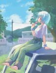  1girl barefoot belt blue_hair blue_sky blurry blurry_background building colored_eyelashes day feet food from_side green_pants hikari_(0607_hikari) motor_vehicle on_truck original outdoors pants parted_lips popsicle power_lines red_eyes shirt shirt_tucked_in short_sleeves sitting sky solo tree white_shirt wristband 