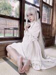  1girl asian bare_legs barefoot black_eyes cosplay_photo dress highres indoors kasugano_sora looking_at_viewer photo_(medium) photoshop_(medium) shi_liang_yu sitting solo tatami white_dress white_hair yosuga_no_sora 