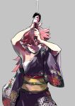  1girl chest_sarashi fighting_stance floral_print floral_print_kimono flower grey_background highres japanese_clothes katana kimono looking_at_viewer midriff_sarashi miyashita_hiroki ninkyou_tensei pink_hair print_kimono red_eyes sanaria_ryuu_lundberg sarashi single_bare_shoulder single_off_shoulder solo spider_lily swept_bangs sword weapon 