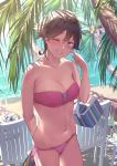  1girl arm_behind_back bag beach bikini blush breasts brown_hair cleavage collarbone commentary_request day flipped_hair grin hand_on_own_cheek hiei_(kantai_collection) highres holding holding_bag kantai_collection looking_at_viewer medium_breasts navel one_eye_closed outdoors palm_tree pink_bikini pink_swimsuit purple_eyes satsuki_neko short_hair side-tie_bikini smile solo standing strapless strapless_bikini swimsuit tree 