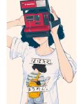  1girl black_hair camera commentary elliemaplefox english_commentary facing_viewer holding holding_camera original shirt short_hair short_sleeves simple_background solo t-shirt tan_background translation_request upper_body 