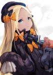  1girl abigail_williams_(fate/grand_order) bangs black_bow black_dress black_headwear blonde_hair blue_eyes blurry blurry_foreground bow closed_mouth commentary_request depth_of_field dress dutch_angle fate/grand_order fate_(series) forehead hair_bow hat highres long_hair long_sleeves looking_at_viewer object_hug orange_bow parted_bangs polka_dot polka_dot_bow samescher sleeves_past_fingers sleeves_past_wrists solo stuffed_animal stuffed_toy teddy_bear very_long_hair 