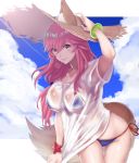  1girl animal_ear_fluff animal_ears bikini bikini_under_clothes blue_bikini blue_sky breasts byakuya_kaien cleavage cloud cloudy_sky collarbone commentary ears_through_headwear eyebrows_visible_through_hair fate/grand_order fate_(series) fox_ears fox_girl fox_tail hat highres looking_at_viewer pink_hair see-through shirt side-tie_bikini sky solo straw_hat swimsuit tail tamamo_(fate)_(all) tamamo_no_mae_(swimsuit_lancer)_(fate) wet wet_clothes wet_shirt wet_t-shirt yellow_eyes 