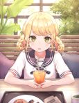  1girl ahoge artist_name black_sailor_collar blonde_hair blush braid cup doughnut drinking_glass drinking_straw food green_eyes hair_rings highres holding juice long_hair looking_at_viewer mug orange_juice original parted_lips plant sailor_collar shirt short_sleeves sidelocks sitting solo soyubee table tray twin_braids white_shirt 